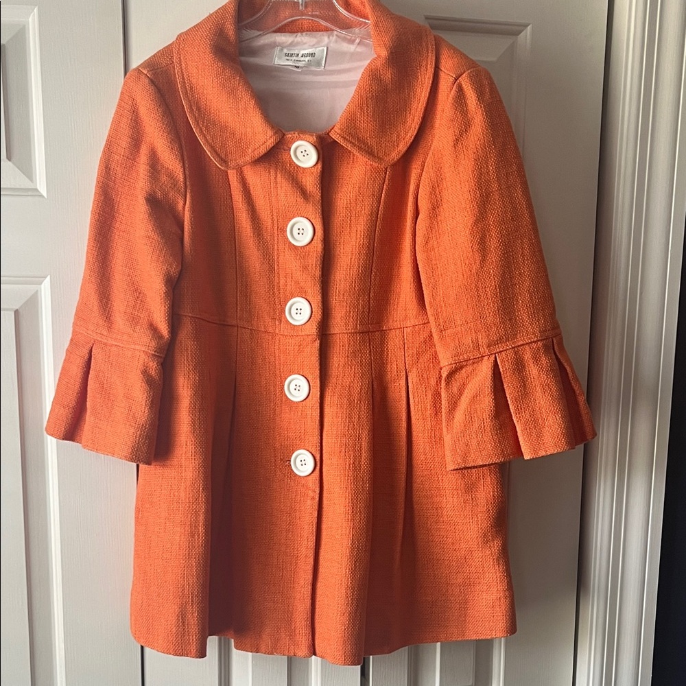 Skirtin Around Vibrant Orange Cape with White Accents